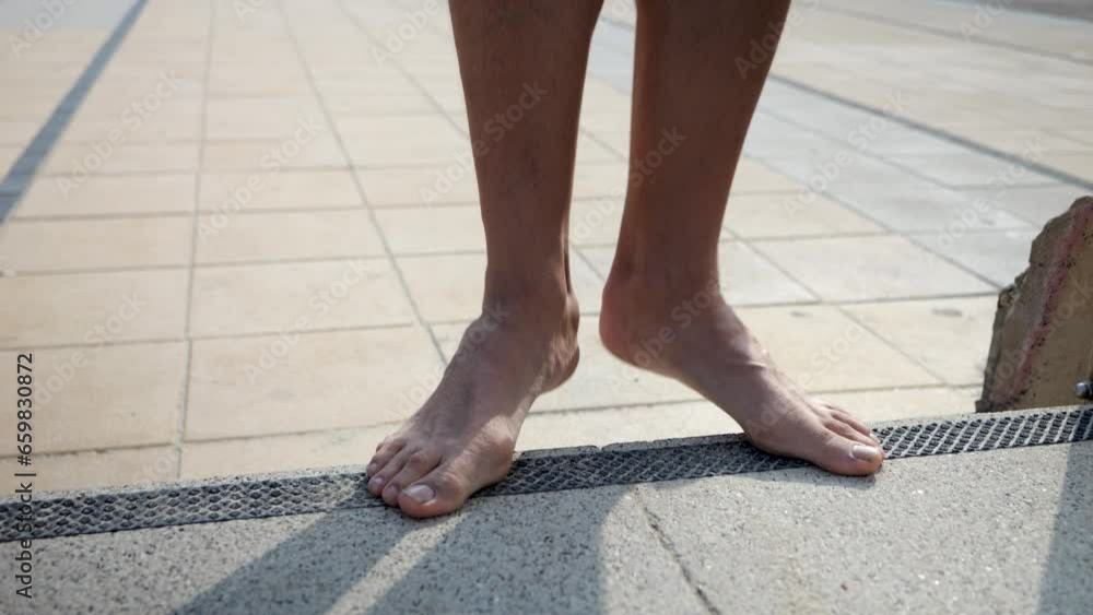 Finding unusual places to exercise. Legs and feet stretching. No pain no gain! Finding unusual places to exercise. Legs and feet stretching. No pain no gain!