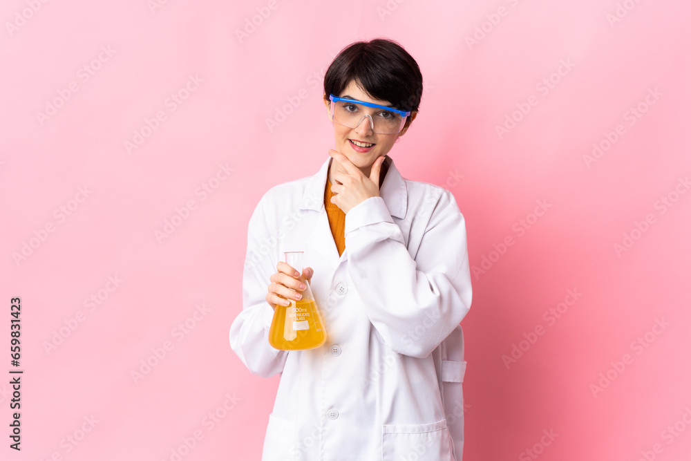 Young scientific woman isolated on pink background happy and smiling Young scientific woman isolated on pink background happy and smiling