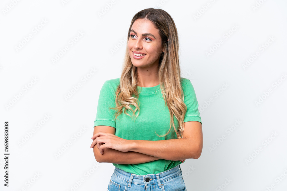 Young Uruguayan woman isolated on white background looking to the side Young Uruguayan woman isolated on white background looking to the side