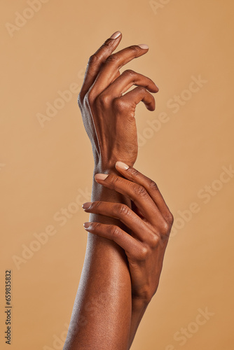 Beautiful black female hands pamper each other photo