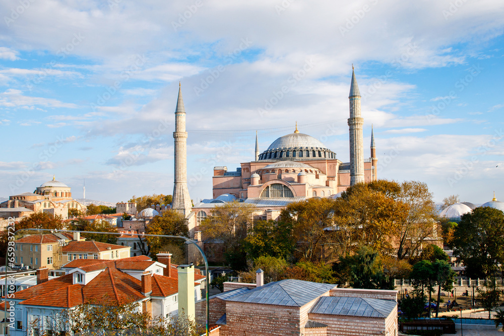 Fototapeta premium Ayasofya Museum, Hagia Sophia in Sultan Ahmet park in Istanbul, Turkey in a beautiful autumn day. Byzantine architecture, city landmark and architectural world wonder