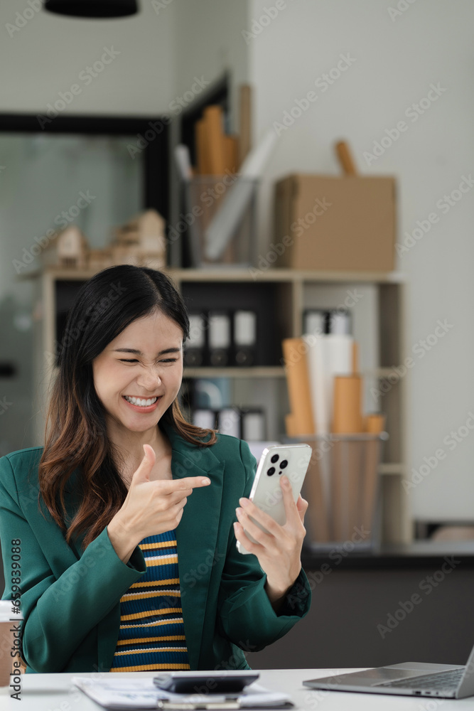 Happy woman having fun doing video call using smartphone and laptop during her free time. Happy woman having fun doing video call using smartphone and laptop during her free time.