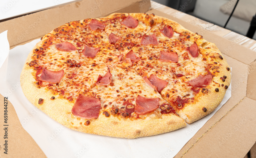 Italian Pizza in Cardboard Delivery Box, Ham Pizza with Green Hot Pepper, Chili Pepper and Mozzarella Cheese