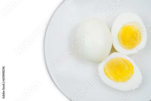 boiled egg on a plate over white background