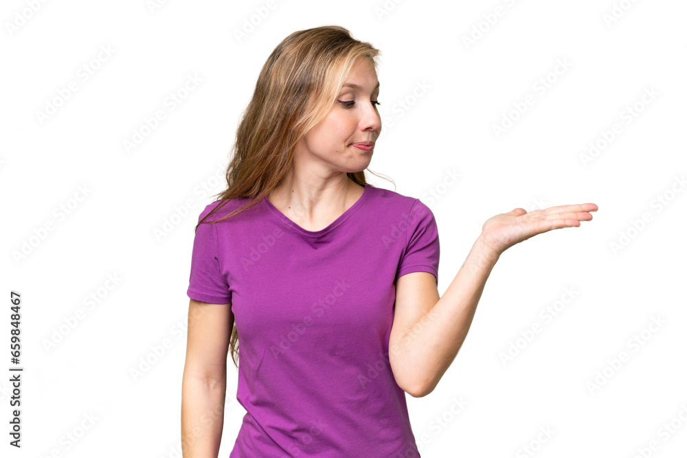 Fototapeta premium Young blonde woman over isolated background holding copyspace with doubts