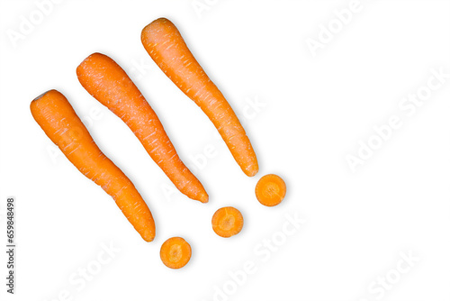 Closeup of whole and cut carrots on white background photo