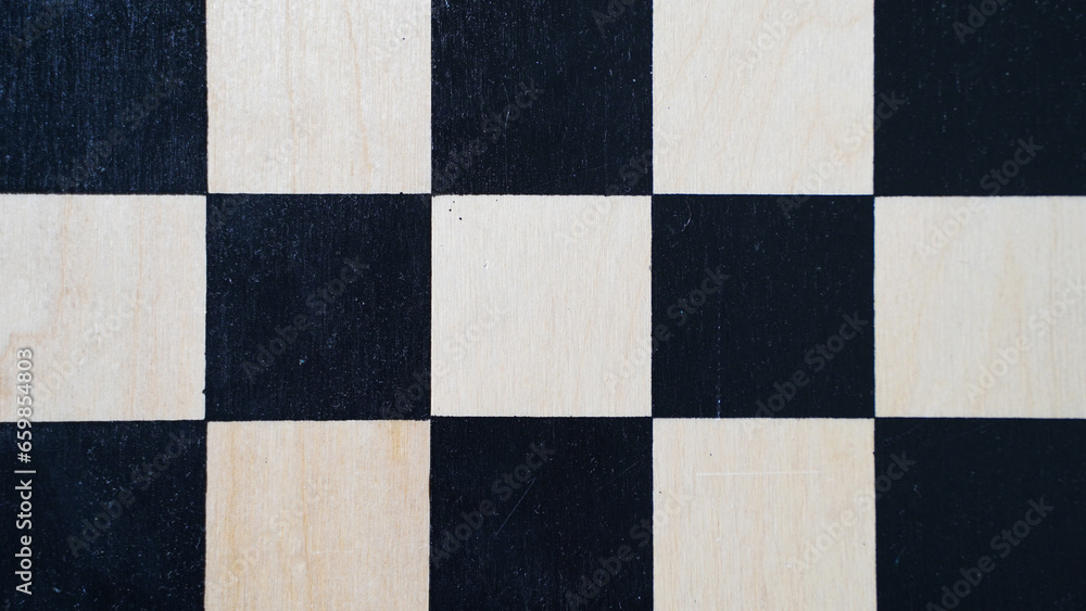 The texture of a wooden chessboard The texture of a wooden chessboard