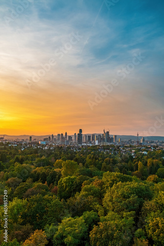 sunset over the city in German. Golden hour in Frankfurt am Main with yellow and blue clouds