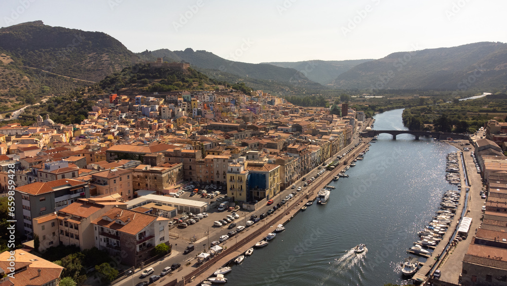 Aerial view of the Temo river as it passes through the town of Bosa, a tourist destination on the island of Sardinia in Italy