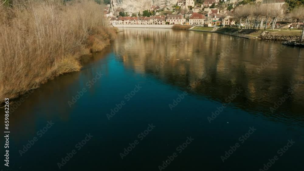 The Dordogne River and the waterside village of La Roque-Gageac. Dordogne, France The Dordogne River and the waterside village of La Roque-Gageac. Dordogne, France