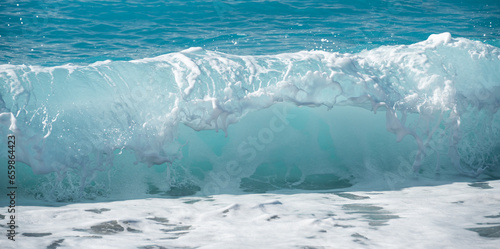 Refreshing sea wave crashing on the coast © ilyaska