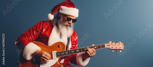 Cheerful Santa playing a musical guitar