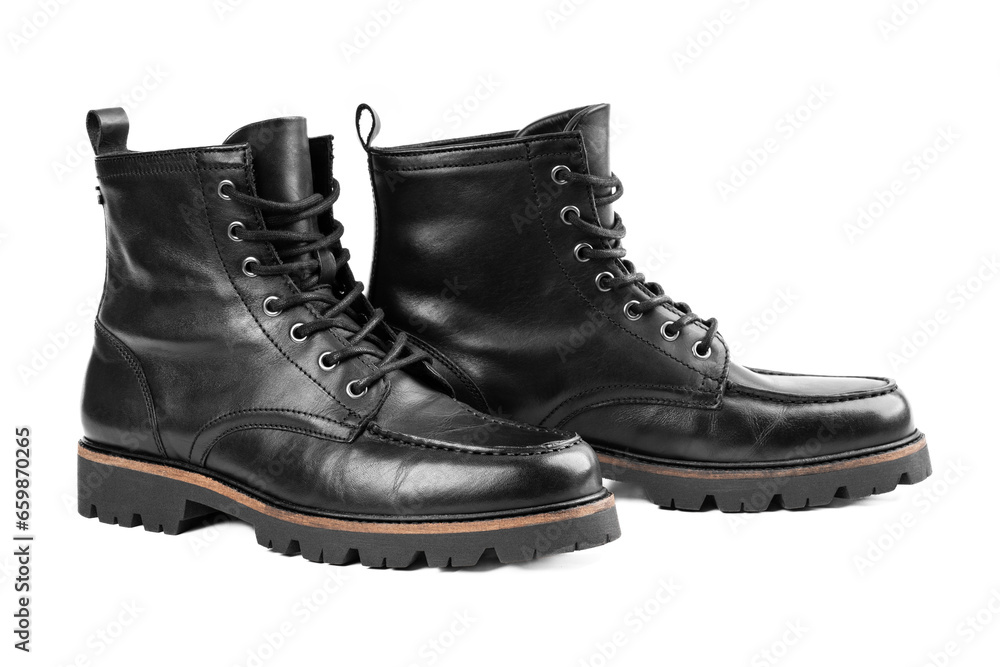 Pair of black leather boots, dress boots for men, men ankle high boots. Black brogue boots on a white background. Men fashion in leather boots. Man's legs in black jeans and brown leather boots. Pair of black leather boots, dress boots for men, men ankle high boots. Black brogue boots on a white background. Men fashion in leather boots. Man's legs in black jeans and brown leather boots.