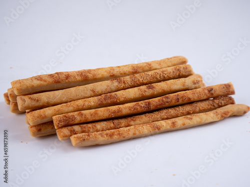 Cheese Sprinkle Stick Cookies are neatly presented and isolated against a white background.
