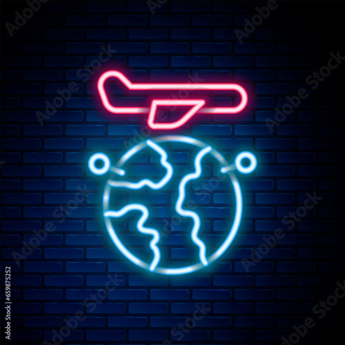 Glowing neon line Globe with flying plane icon isolated on brick wall background. Airplane fly around the planet earth. Aircraft world icon. Colorful outline concept. Vector