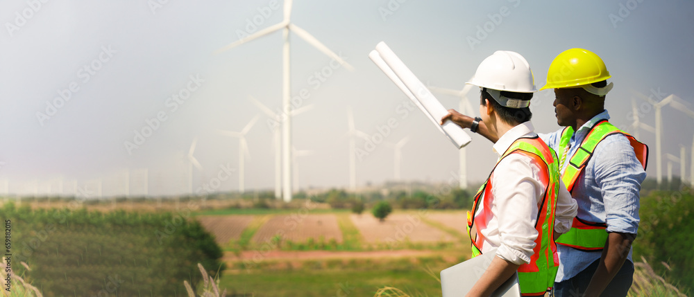 Picture of Wind turbine engineer. Male engineer maintains and controls wind ...