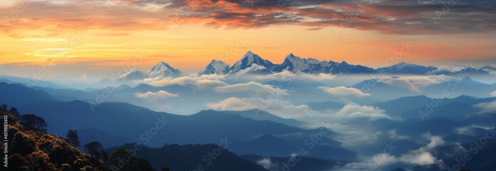 A high mountain range basks in the warm, enchanting colors of sunset