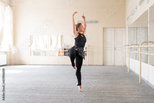 young ballet dancer doing solo practice performance in the dance studio