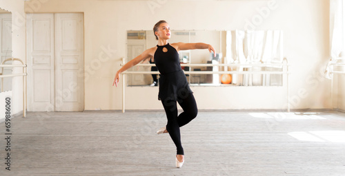 professional ballerina dancer doing ballet dance moves on a master class