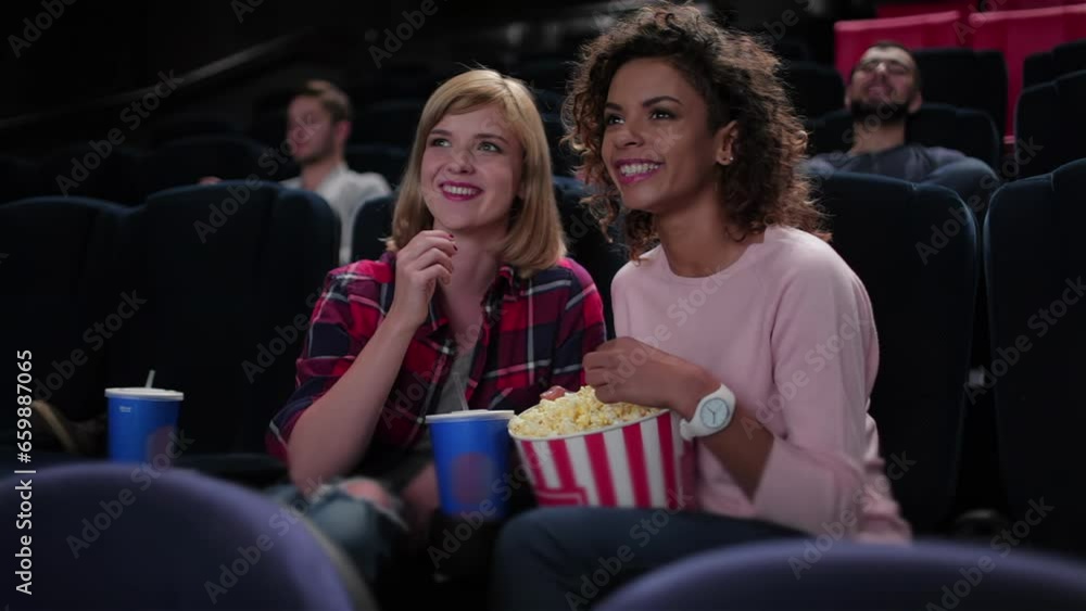 Woman eating popcorn and watching movie Woman eating popcorn and watching movie