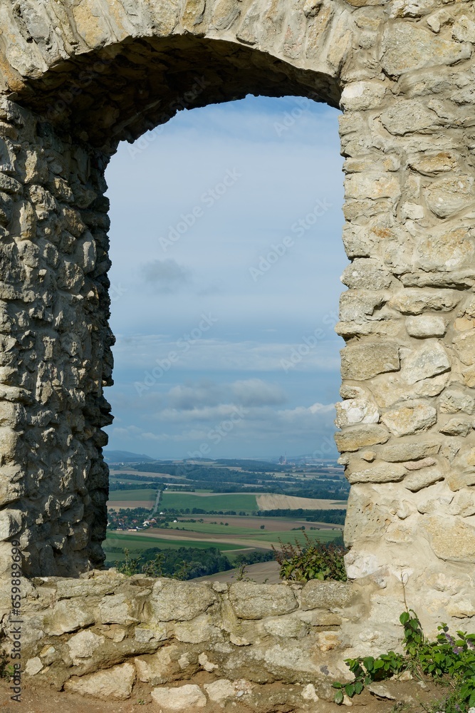 Ruins of Stary Jicin Castle. A view of the region through a window in the castle wall. Czechia. 