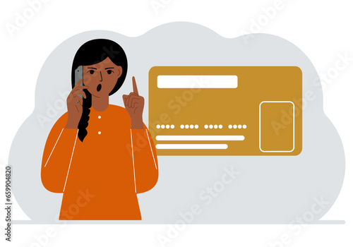The woman is talking on the phone. Nearby is a large plastic card.