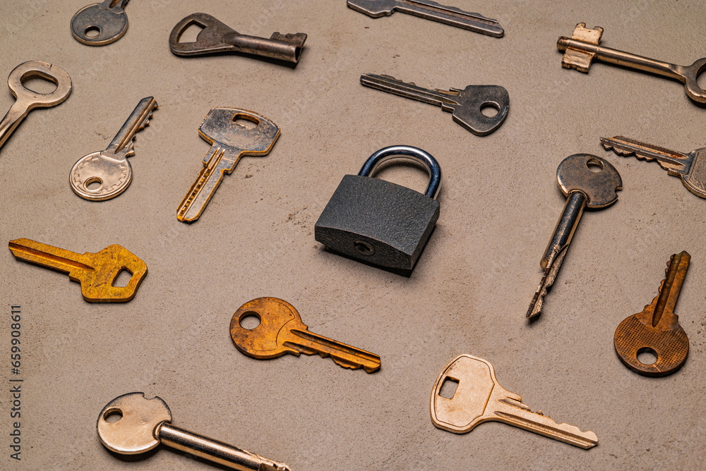 check-lock and different keys on concrete background concept check-lock and different keys on concrete background concept