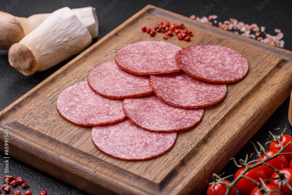 Delicious fresh smoked sausage with salt and spices cut into slices Delicious fresh smoked sausage with salt and spices cut into slices