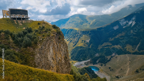 Fotografie Panorama of the Caucasus mountains with the Russo-Georgian Friendship Monument