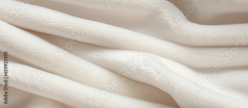 Close up of white velour fabric with a simple pattern creating an abstract beige background