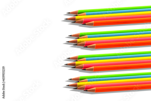 Multiple groups of sharpened colourful pencils on white background.