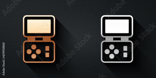 Gold and silver Portable tetris electronic game icon isolated on black background. Vintage style pocket brick game. Interactive playing device. Long shadow style. Vector