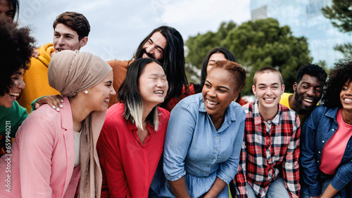 Фотография Multiethnic diverse group of people having fun outdoor - Multiracial community l