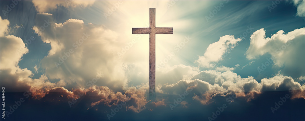 Fototapeta premium cross in clouds symbol of the death and resurrection , copy space for text.