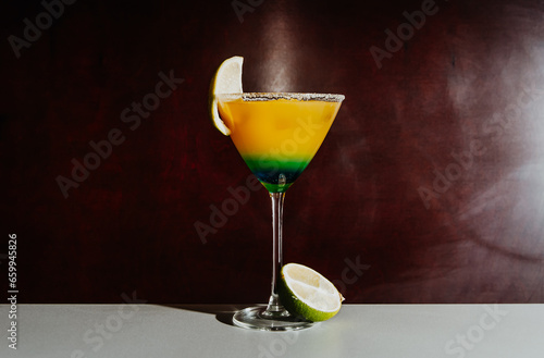 freshly made tropicana cocktail against dark background