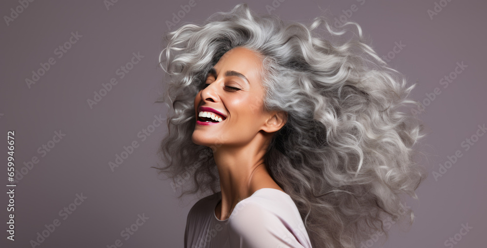 Black adult woman with smooth healthy skin. Beautiful aging mature woman with long gray hair and happy shy smiling. Beauty and cosmetics skincare advertising concept. Black adult woman with smooth healthy skin. Beautiful aging mature woman with long gray hair and happy shy smiling. Beauty and cosmetics skincare advertising concept.