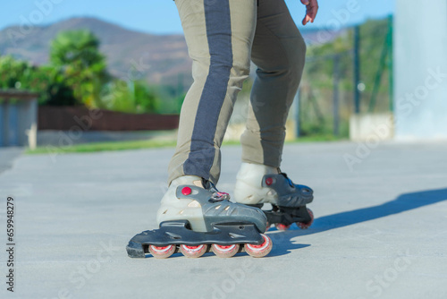 skater on a paved road outdoors on a hot day © breng08