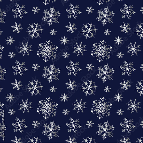 The pattern is beautiful with white silver snowflakes on a blue background