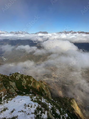 Mountain landscape with clouds and fog on the top of the hill © FromWithLove