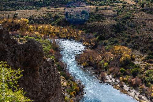 Beautiful view of a Patagonian valley crossed by a river in autumn