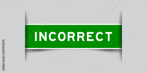 Green color square label sticker with word incorrect that inserted in gray background