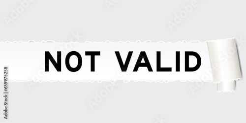 Ripped gray paper background that have word not valid under torn part