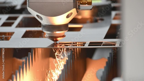 The fiber laser cutting machine  cut the metal plate with the sparkling light.