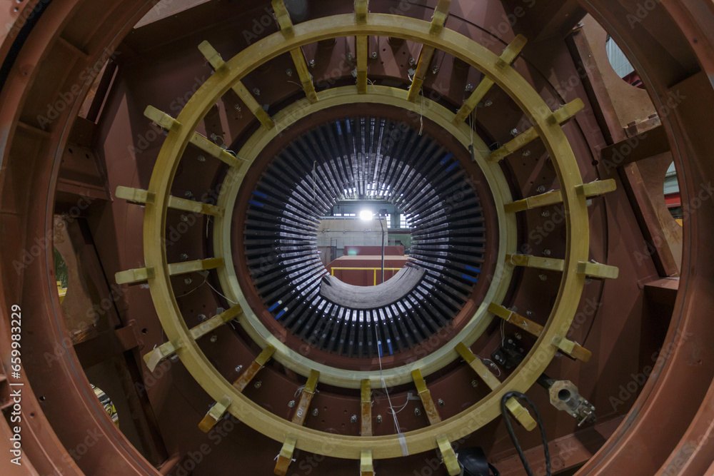 Assembling stator winding in factory workshop. Assembling stator winding in factory workshop.