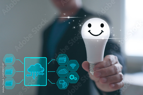 Digital innovation. Business man Hand holding smile light bulb, innovation technology, business icons on network connection