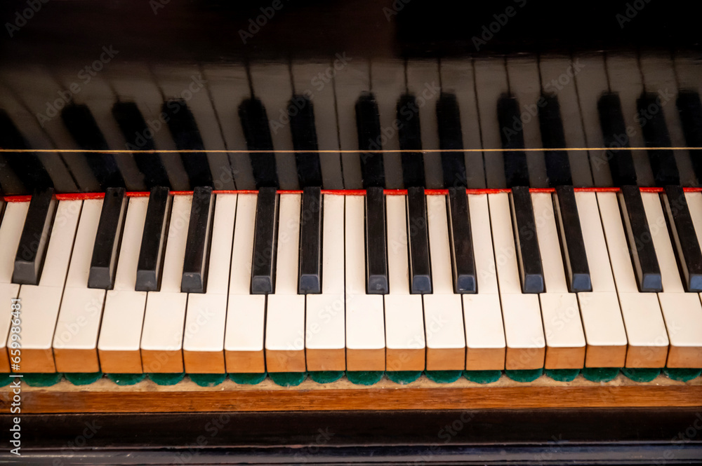 piano keys close up, pen classical piano showing the strings internal mechanisms piano keys close up, pen classical piano showing the strings internal mechanisms