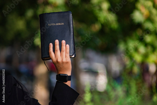 Hand up holy bible woman nature