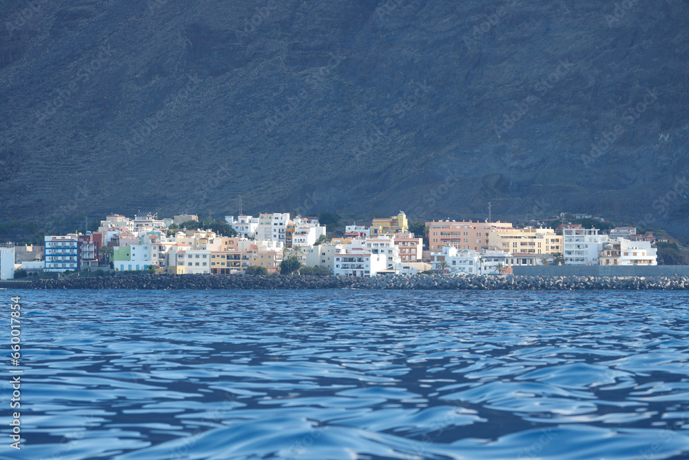 La Gomera, Spain. Onshore view of the coastline of Valle Gran Rey with the small town of Vueltas.