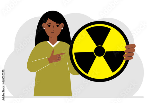A woman holds in his hand a large sign warning about radiation danger. Vector