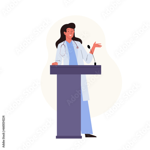 Female medical doctor standing at podium and giving a speech at a medicine conference. Presentation scientific research